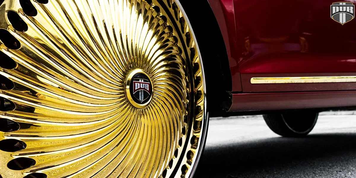 Old school car on gold chrome-plated wheels — Jacksonville FL